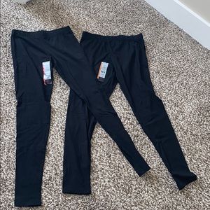 two pairs of black leggings